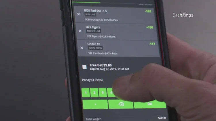 Polis signs law imposing new limits on sports betting in...
