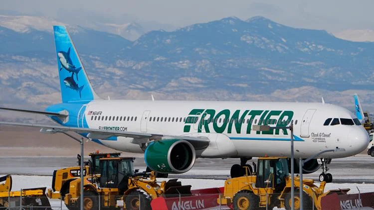 Frontier flight diverted after passenger tried to open...